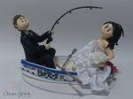 Noivos pescando a noiva pelo vestido, no barco. cd: 371