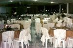 Vista geral da decoração das mesas dos convidados em uma recepção de casamento.Doc.3-BN