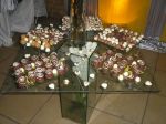 Mesa de chocolates em vidro